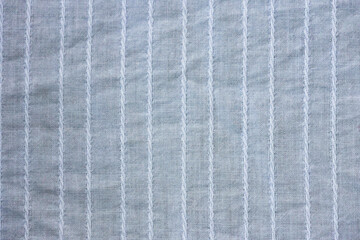Fototapeta premium Background texture of light blue fabric close-up