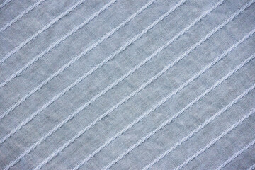 Fototapeta premium Background texture of light blue fabric close-up