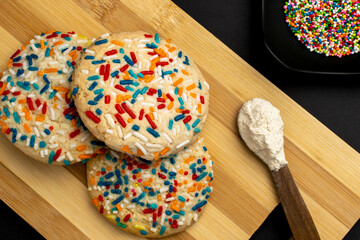 Colorful Sprinkle Cookies on Wooden Table