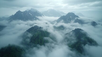 Obraz premium Aerial view of misty mountains, green forests, cloudy sky. Travel background