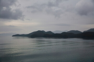 Cloudy coast area with calm ocean