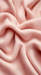 Soft pink fabric texture with gentle folds and creases, ideal for branding mockups and design projects