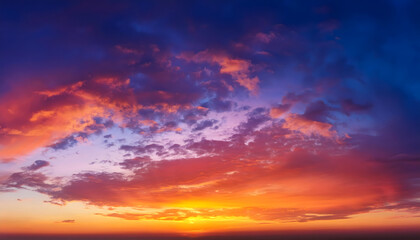 Obraz premium Clear blue sky. glowing pink and golden cirrus. view of sky during sunset
