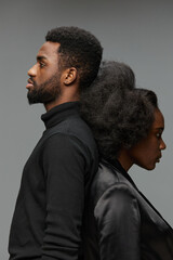 A striking black and white portrait of a male and female model, showcasing strong emotions and...