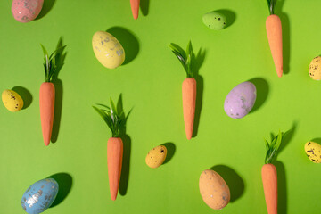 Easter pattern made with carrots on bright blue background. Creative minimal holiday concept