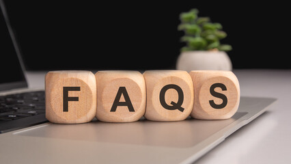 Close-up Shot of FAQS wooden blocks.