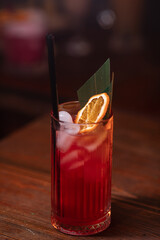 cocktail in a restaurant, professional shooting. a cocktail glass filled with a bright drink, decorated with additional decor. professional photography of a drink
