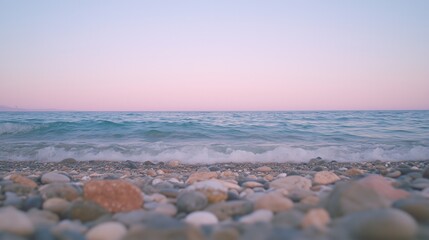 Tranquil seaside at dusk with gentle waves and smooth pebbles