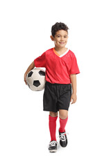 Boy carrying a football and walking