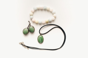 Jewelry with jade. Pendant with jade and earrings. Jewelry with green stone. Earrings with pendant.