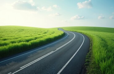 Fototapeta premium Scenic winding road through green field. Asphalt road curves through vibrant grassy field under bright sunlight. Peaceful rural landscape. Summer day. Empty road. Natural background. Countryside