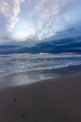 Beautiful seaside and dunes landscape at Piémanson beach at the camargue, france, in early spring during sundown