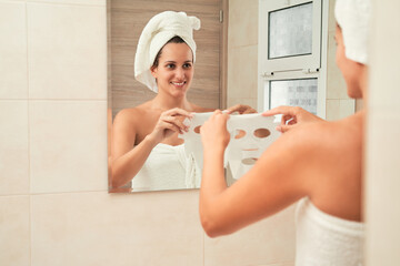 Woman enjoying skincare routine with face mask. Skincare concept.
