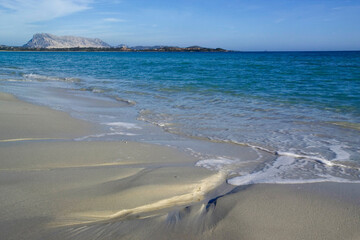 wind marks on the beach Shapes sculpted by the wind and surf around pebbles  on La Cinta beach. San Teodoro Nuoro, Sardinia. Italy