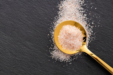 Himalayan pink fine salt - Salt in pure crystals on the spoon.
