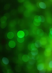 Obraz premium A blurry green background with a few green circles bokeh green bokeh green abstract background light bright blur pattern