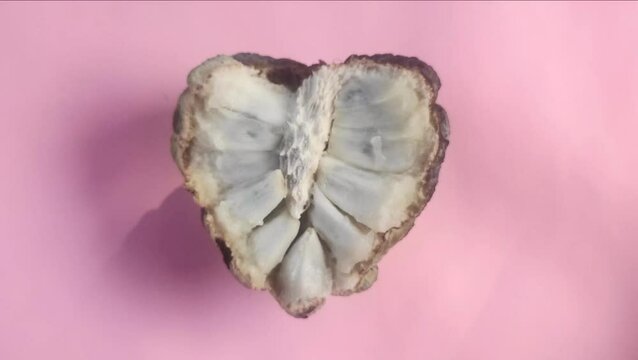 Sugar apple or Annona squamosa isolated on pink background.
