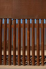 Afternoon view of the iron metal border wall between San Luis Río Colorado, Sonora, Mexico and San Luis, Arizona, USA
