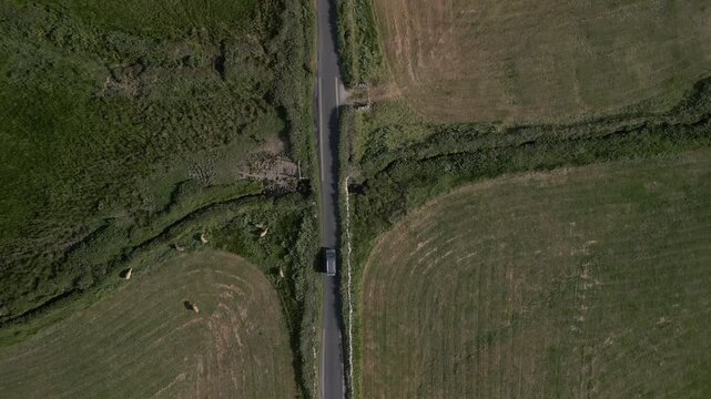 Aerial video of a vehicle traveling in the Doolin Tower area, Ireland