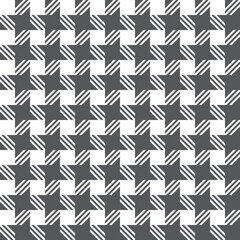 Seamless houndstooth pattern. Classic plaid design. It is characterized by a pattern of alternating squares resembling a scattered star in two colors.