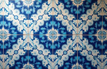 Ornate ceramic tile wall pattern displays intricate arabesque designs in blue, white. Islamic style decoration. Seamless pattern suitable for wall floor. Traditional Arabic design. Artistic tile work