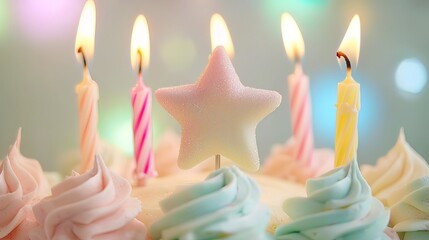 Close-up of a birthday cake with pastel frosting, lit candles, and a star-shaped topper.