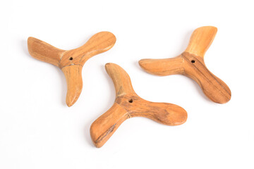 Traditional wooden massage tool isolated on white background.