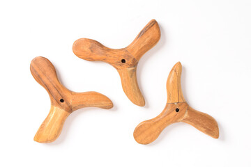 Traditional wooden massage tool isolated on white background.