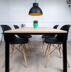 Modern Minimalist Dining Room with Black Chairs and Yellow Pendant Light