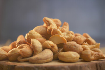 Fototapeta premium Collection of assorted nuts arranged on a wooden surface