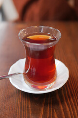 Freshly brewed tea served in a traditional glass cup in a cafe