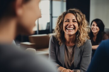 Close up of a middle aged female therapist doing group therapy