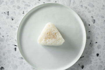 A top down view of a tuna mayo onigiri.