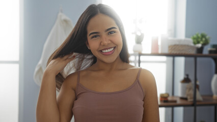 Naklejka premium Woman smiling in a spa, showcasing beauty, relaxation, and wellness, with a serene indoor setting and elegant styling, exuding youthful and vibrant energy.