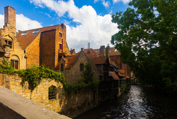 Picturesque summer landscape with views of houses and canals in the small town of Brugge, Belgium