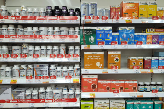 Penang, Malaysia - Feb 2, 2025: A well-stocked phamacy shelf displaying various vitamins and supplements, including Bio-Life, VitaHealth, and other health products.