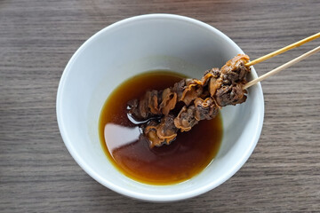 Sate Kerang, cockles satay or cockles skewer,  Indonesian Food made from cockles and covered with soy sauce.
