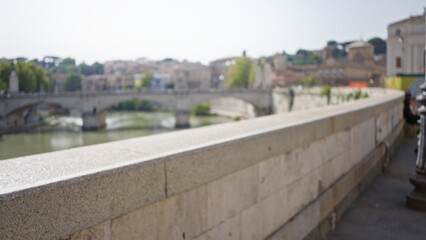 Fototapeta premium Blurred view of an old street in rome with defocused buildings and bokeh lights, capturing the essence of historic italian urban life outdoors.