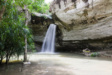 Naklejka premium Saeng Chan Waterfall (Long Ru Waterfall), Pha Taem National Park, “Unseen Thailand”, named after the waterfall that sprays mist through the rocks, giving it a soft white color similar to moonlight.
