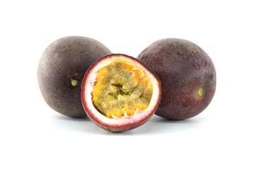 Two passion fruits and a half showing the pulp on a white background