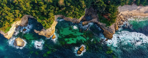 Aerial view of a lush coastline with rocky formations and turquoise waters, surrounded by vibrant greenery and gentle waves.