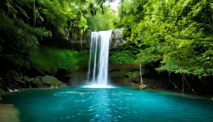 waterfall cascading into an emerald pool 