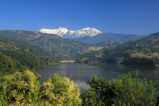 Snow capped Annapurna Range and Lake Begnas, Nepal.