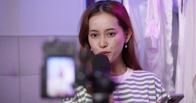 A content creator passionately engages with her audience during a vibrant live streaming session.