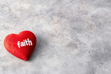 Fototapeta premium Red Heart Icon with the Word Faith Symbolizing Love and Family Connection