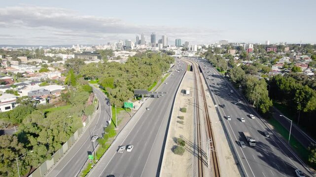Cars Driving on Highway 2 Along The Yanchep Line In Suburban Perth City, Western Australia. - aerial shot