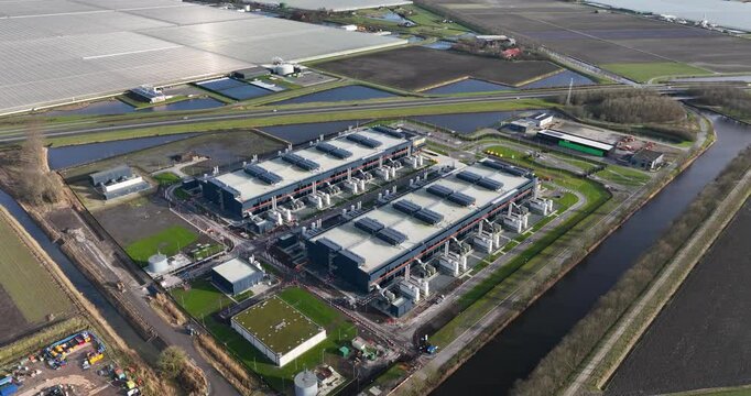 Data center, super computer, quantum computing, storage clouds space and internet infrastructure in the Netherlands, an aerial drone video.