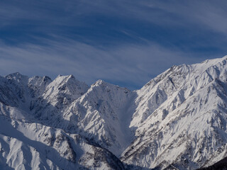 晴天の空と雪の北アルプス　長野県白馬村