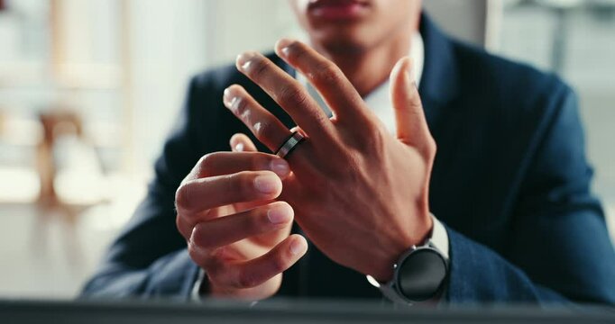 Hands, divorce and man with wedding ring, stress and nervous or fear breakup in office. Finger, marriage band and person closeup with jewelry for anxiety, mistake and thinking of separation or fail