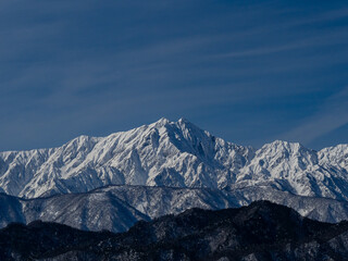 晴天の空と雪の北アルプス　長野県白馬村